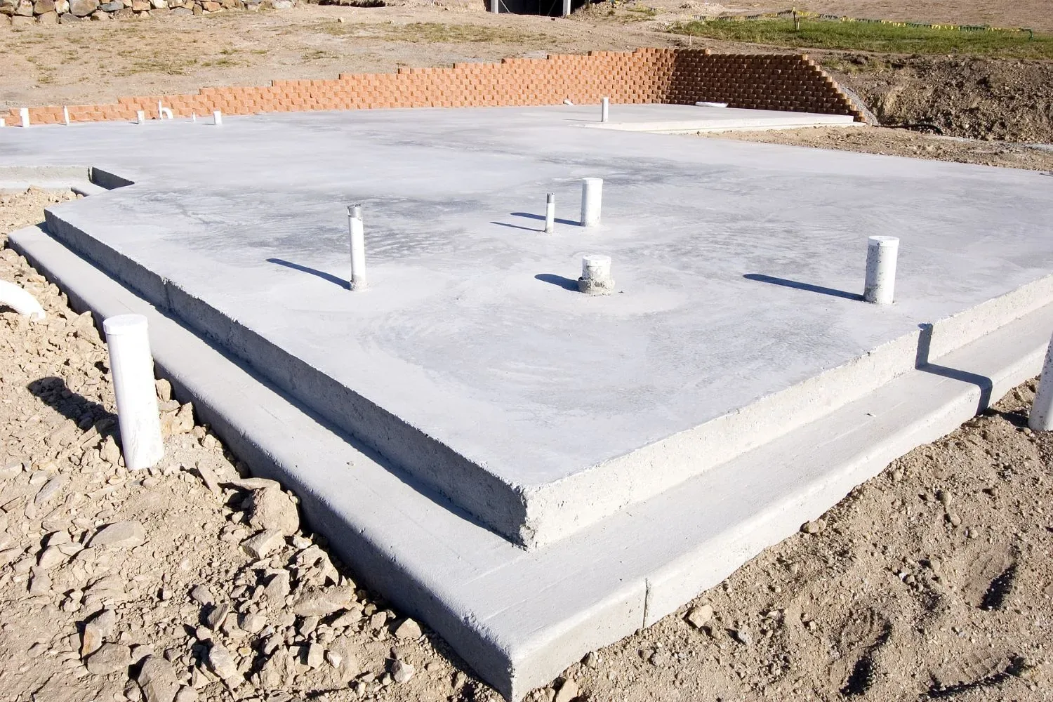 Freshly poured concrete slab prepared for a new build