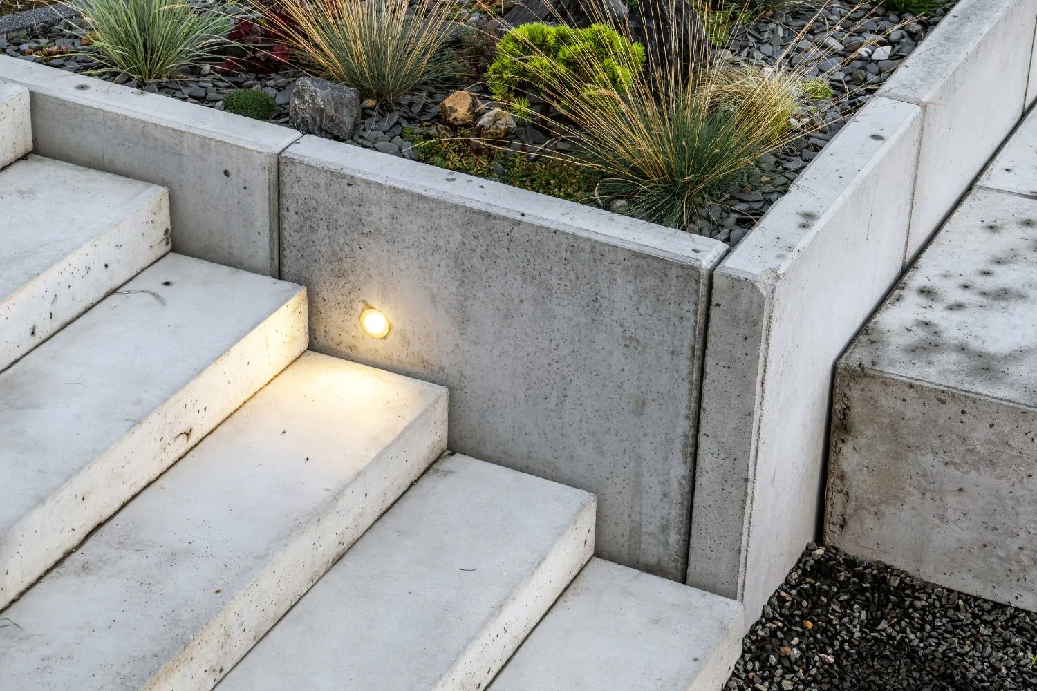 Concrete steps set out to sit level with the surrounding garden